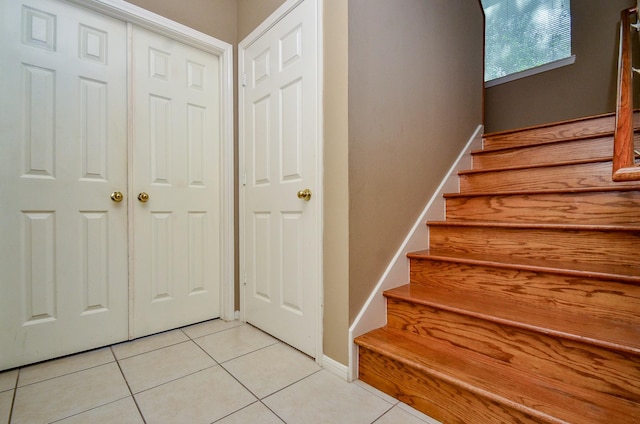 4415 Crimson Ct, Sugar Land, TX 77479 - stairway featuring tile patterned floors