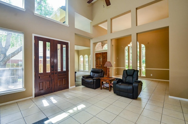 4415 Crimson Ct, Sugar Land, TX 77479 - entrance foyer featuring light tile patterned flooring, ceiling fan, and a high ceiling
