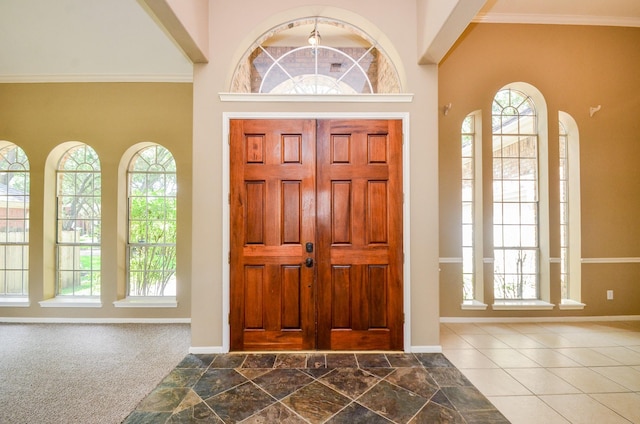 4415 Crimson Ct, Sugar Land, TX 77479 - entrance foyer featuring healthy amount of natural light, a towering ceiling, and ornamental molding