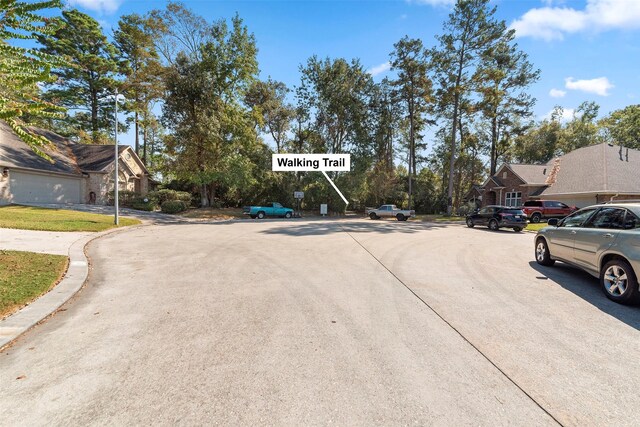 3318 Misty Alcove Ct, Kingwood, TX 77345 - view of concrete road with a residential view