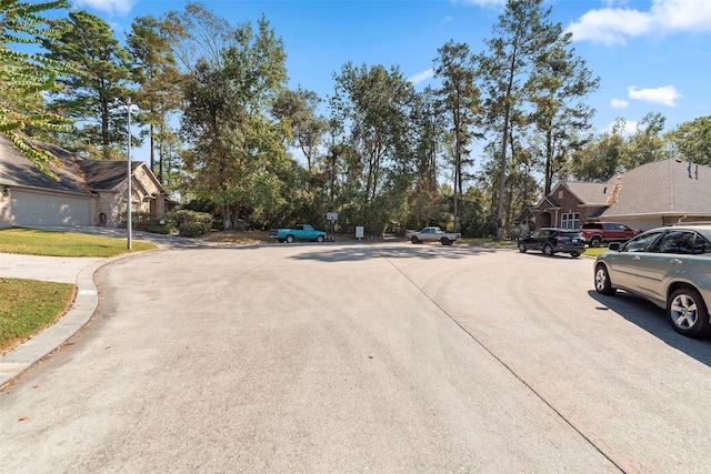 3318 Misty Alcove Ct, Kingwood, TX 77345 - view of concrete street with a residential view