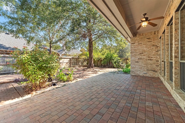3318 Misty Alcove Ct, Kingwood, TX 77345 - fenced backyard with a ceiling fan and a patio