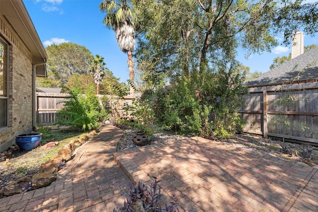 3318 Misty Alcove Ct, Kingwood, TX 77345 - fenced backyard featuring a patio area