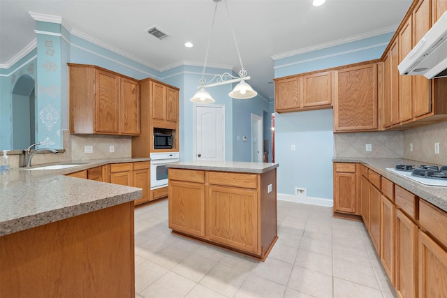 3318 Misty Alcove Ct, Kingwood, TX 77345 - kitchen featuring extractor fan, white appliances, ornamental molding, backsplash, and pendant lighting
