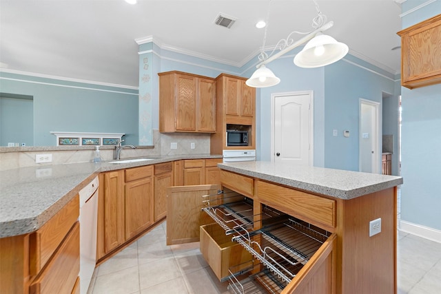 3318 Misty Alcove Ct, Kingwood, TX 77345 - kitchen featuring white appliances, backsplash, crown molding, light tile patterned floors, and a kitchen island