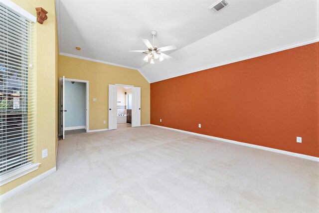 3318 Misty Alcove Ct, Kingwood, TX 77345 - unfurnished bedroom with light carpet, crown molding, vaulted ceiling, ceiling fan, and connected bathroom
