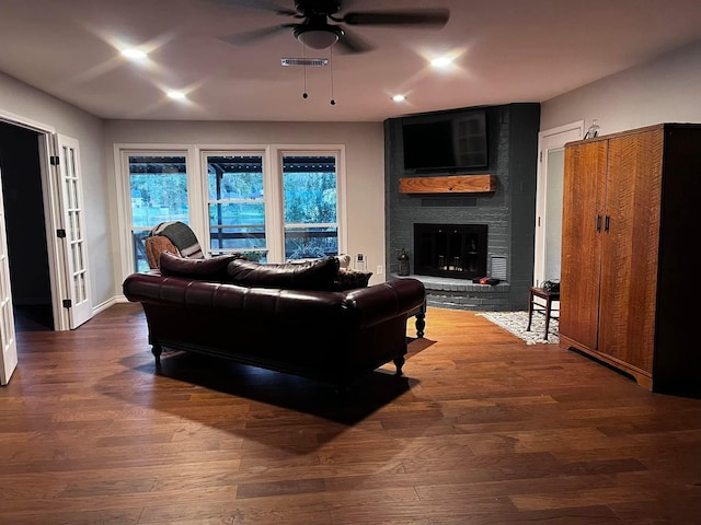 230 W Lake Dr, Livingston, TX 77351 - living room featuring a ceiling fan, a brick fireplace, wood finished floors, and recessed lighting