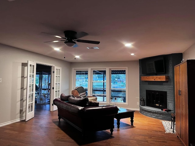 230 W Lake Dr, Livingston, TX 77351 - living area with ceiling fan, wood finished floors, a brick fireplace, and recessed lighting