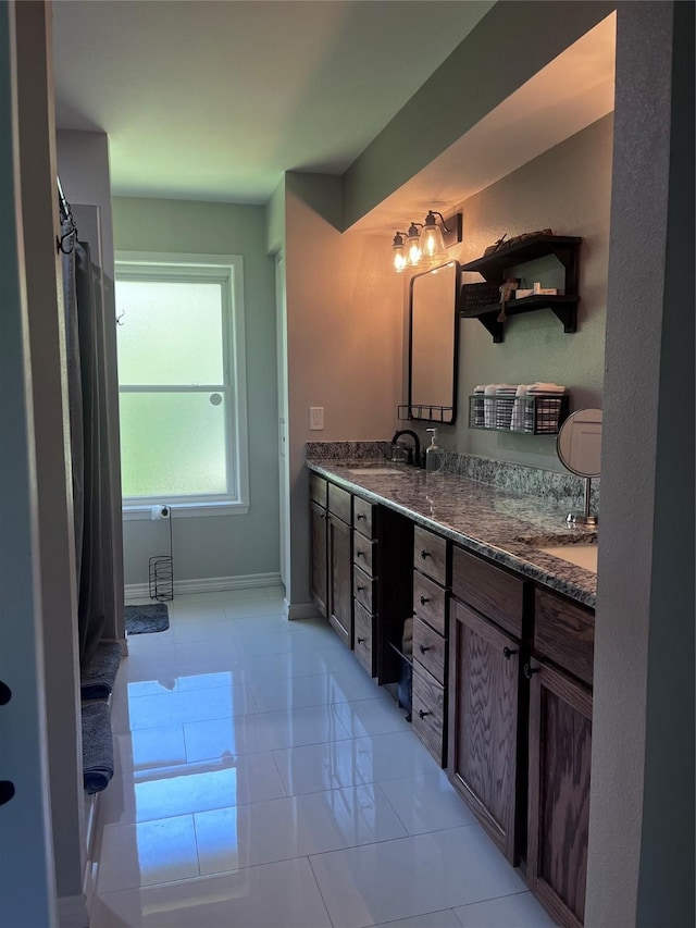 230 W Lake Dr, Livingston, TX 77351 - full bath featuring double vanity and tile patterned floors