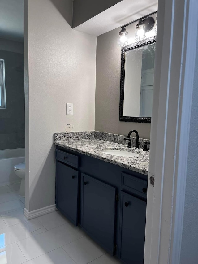 230 W Lake Dr, Livingston, TX 77351 - bathroom featuring vanity, tile patterned flooring, and a tub to relax in
