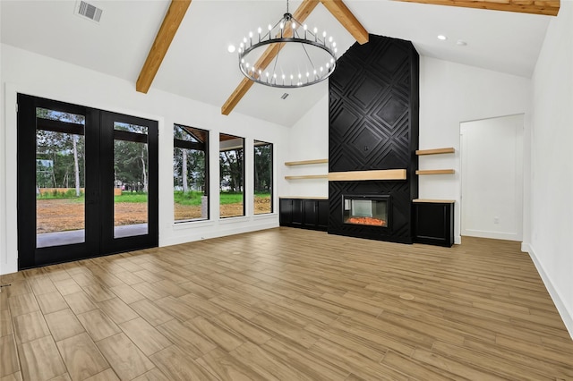 200 Rd 6615, Dayton, TX 77535 - unfurnished living room featuring high vaulted ceiling, a chandelier, beam ceiling, and a large fireplace