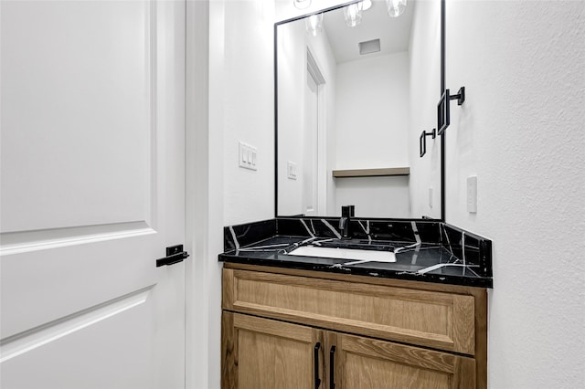 200 Rd 6615, Dayton, TX 77535 - bathroom featuring vanity and a textured wall