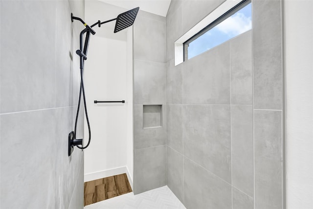 200 Rd 6615, Dayton, TX 77535 - bathroom featuring tiled shower and wood finished floors