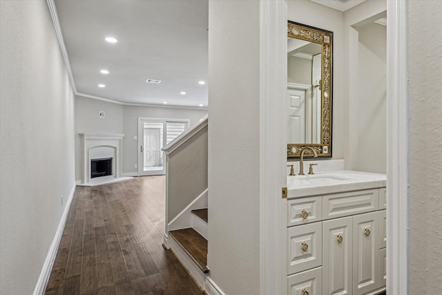 974 Memorial Village Dr Unit 53, Houston, TX 77024 - hall with ornamental molding, dark wood finished floors, stairs, and recessed lighting