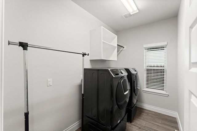 19838 Blue Roan Dr, Tomball, TX 77377 - washroom with washer and dryer and dark wood-style flooring