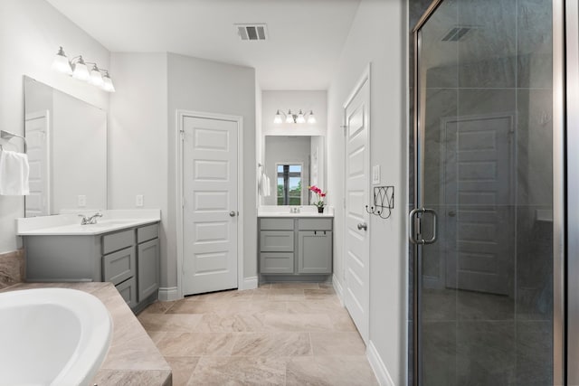 19838 Blue Roan Dr, Tomball, TX 77377 - full bath with two vanities, a shower stall, and a garden tub