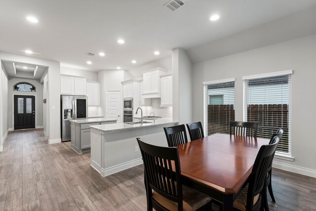 19838 Blue Roan Dr, Tomball, TX 77377 - dining space with wood finished floors and recessed lighting