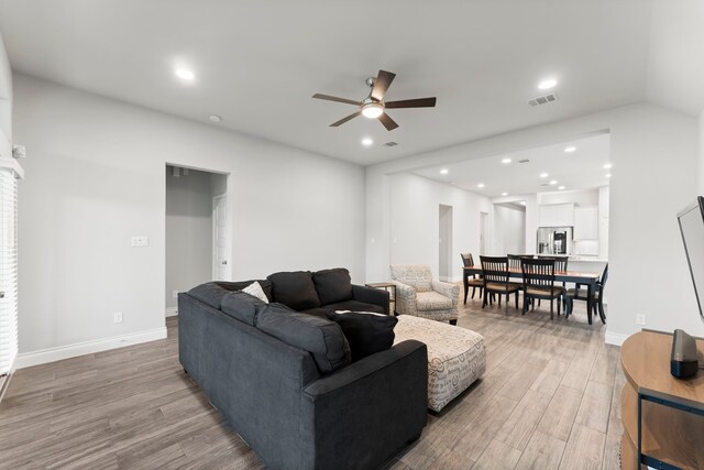 19838 Blue Roan Dr, Tomball, TX 77377 - living area featuring a ceiling fan, light wood-type flooring, and recessed lighting
