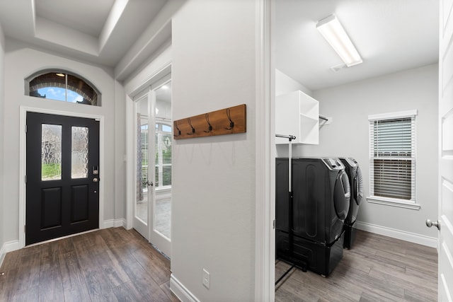 19838 Blue Roan Dr, Tomball, TX 77377 - laundry room featuring washing machine and dryer and wood finished floors