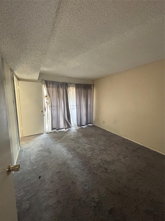 6347 Cattails Ln Unit 63, Houston, TX 77035 - spare room featuring carpet floors and a textured ceiling