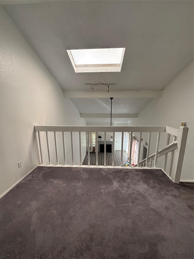 6347 Cattails Ln Unit 63, Houston, TX 77035 - unfurnished living room featuring carpet and a skylight