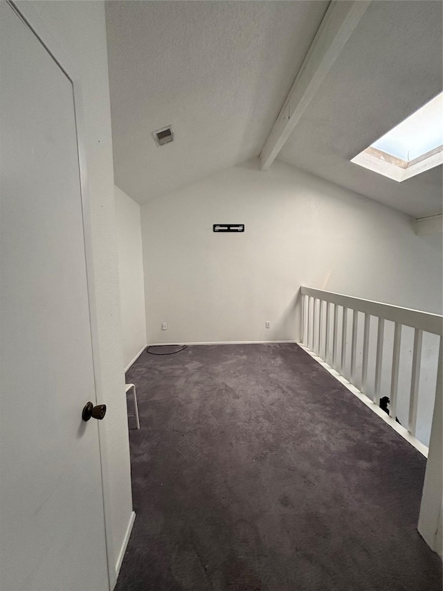 6347 Cattails Ln Unit 63, Houston, TX 77035 - carpeted empty room featuring a skylight and a textured ceiling