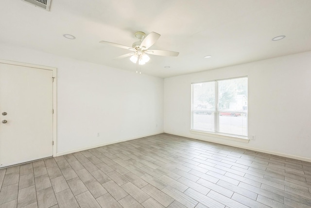 4707 Dove Springs Dr, Austin, TX 78744 - unfurnished room featuring ceiling fan, recessed lighting, and light wood-style floors