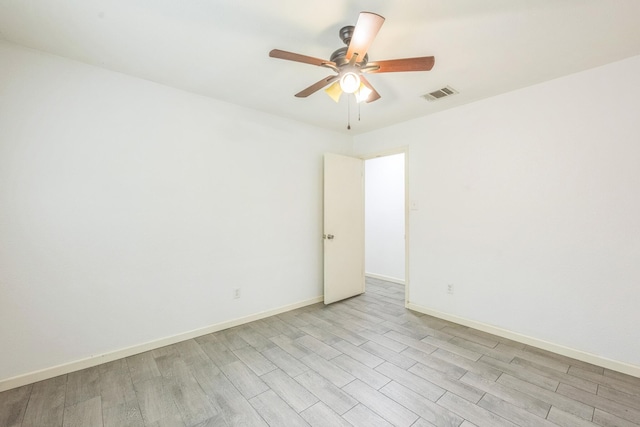 4707 Dove Springs Dr, Austin, TX 78744 - unfurnished room with light wood-type flooring and ceiling fan