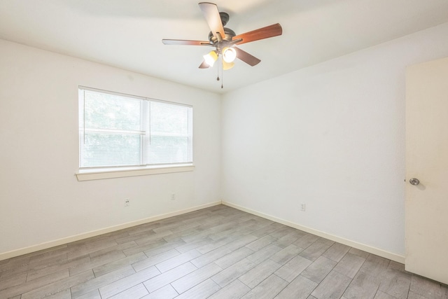 4707 Dove Springs Dr, Austin, TX 78744 - empty room with ceiling fan and light wood-style flooring