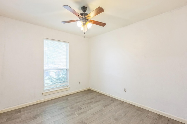 4707 Dove Springs Dr, Austin, TX 78744 - empty room featuring light wood-style floors and a ceiling fan