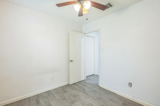 4707 Dove Springs Dr, Austin, TX 78744 - empty room with ceiling fan and light wood finished floors