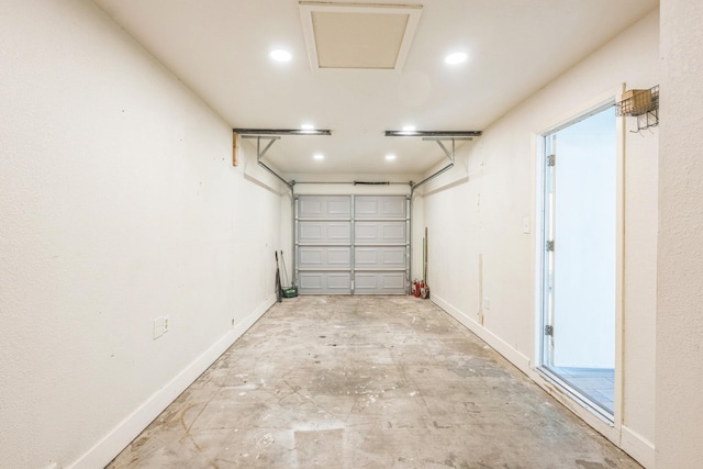 4707 Dove Springs Dr, Austin, TX 78744 - garage featuring baseboards and recessed lighting