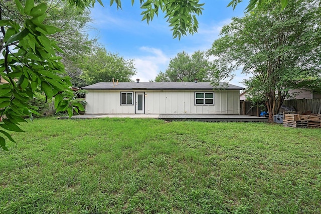 4707 Dove Springs Dr, Austin, TX 78744 - rear view of property with board and batten siding and a deck