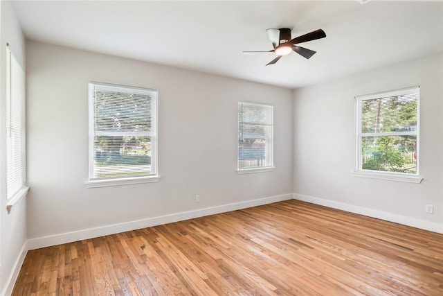 153 E Rittenhouse St, Houston, TX 77076 - empty room featuring plenty of natural light, light wood-type flooring, and a ceiling fan