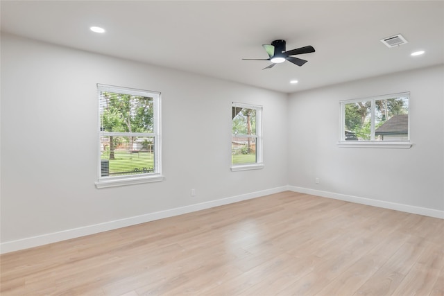 153 E Rittenhouse St, Houston, TX 77076 - empty room with healthy amount of natural light, light wood-style floors, ceiling fan, and recessed lighting