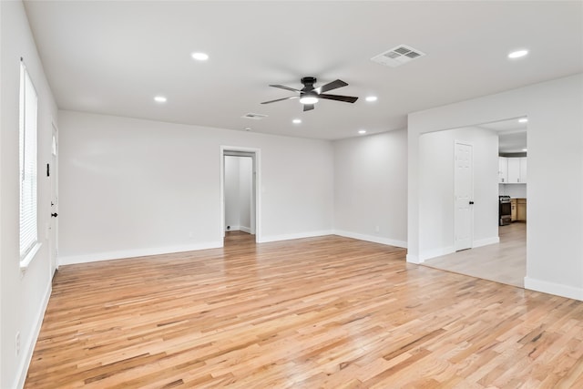 153 E Rittenhouse St, Houston, TX 77076 - empty room with light wood-style floors, a ceiling fan, and recessed lighting