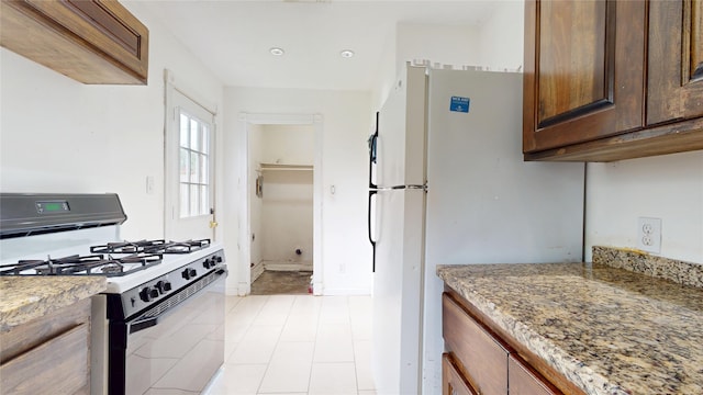 907 Axilda St, Houston, TX 77017 - kitchen featuring white appliances and light stone countertops