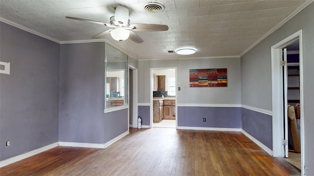 907 Axilda St, Houston, TX 77017 - spare room with a ceiling fan, wood-type flooring, and crown molding