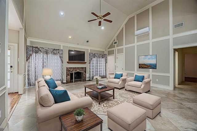 4417 Alamance St, Baytown, TX 77521 - living room with a decorative wall, high vaulted ceiling, ceiling fan, a stone fireplace, and recessed lighting