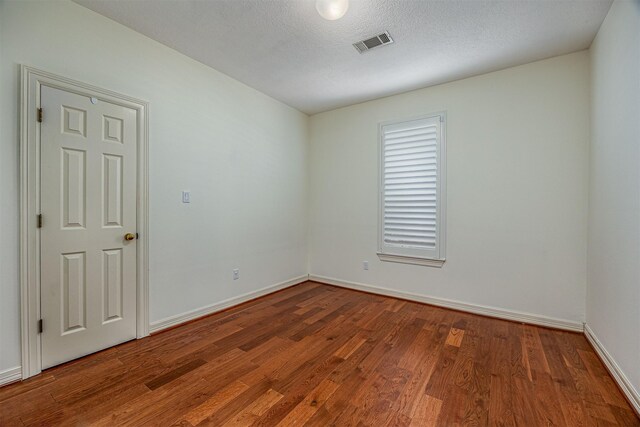 4417 Alamance St, Baytown, TX 77521 - unfurnished room with wood finished floors and baseboards