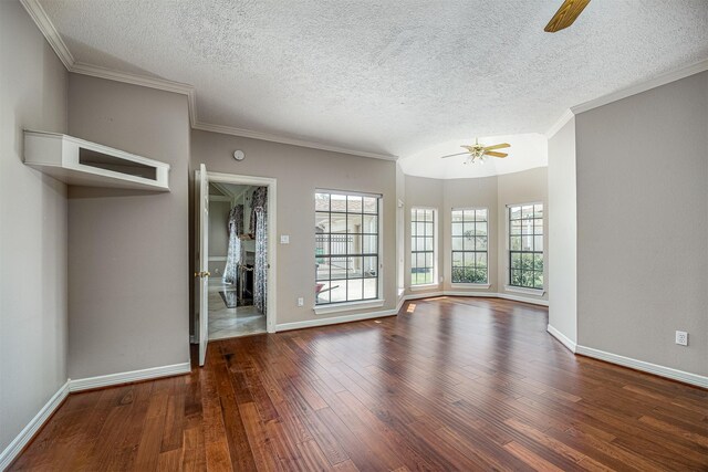 4417 Alamance St, Baytown, TX 77521 - unfurnished living room with a ceiling fan, wood finished floors, a textured ceiling, and crown molding