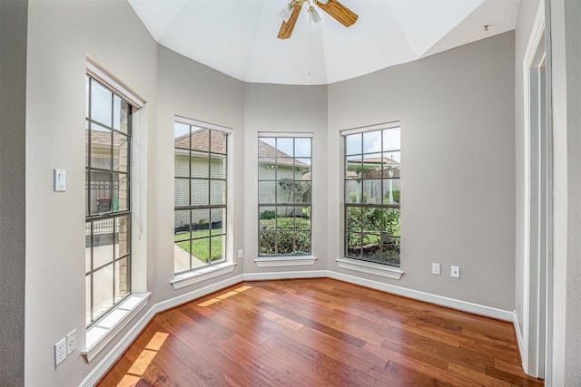 4417 Alamance St, Baytown, TX 77521 - unfurnished room featuring wood finished floors, plenty of natural light, lofted ceiling, and a ceiling fan