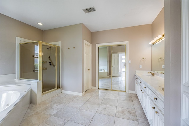 4417 Alamance St, Baytown, TX 77521 - full bath with a shower stall, a whirlpool tub, double vanity, and tile patterned flooring
