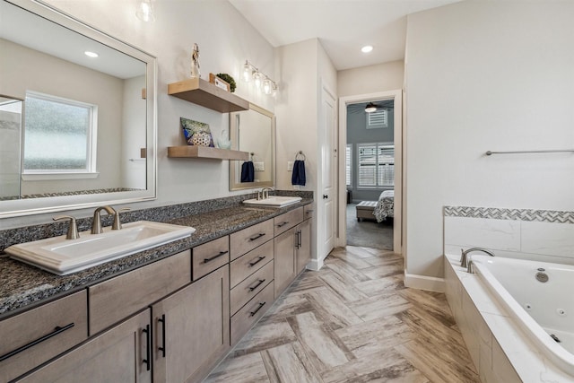 2802 Tarragon Crest Dr, Katy, TX 77494 - bathroom featuring a whirlpool tub, ensuite bath, double vanity, ceiling fan, and recessed lighting