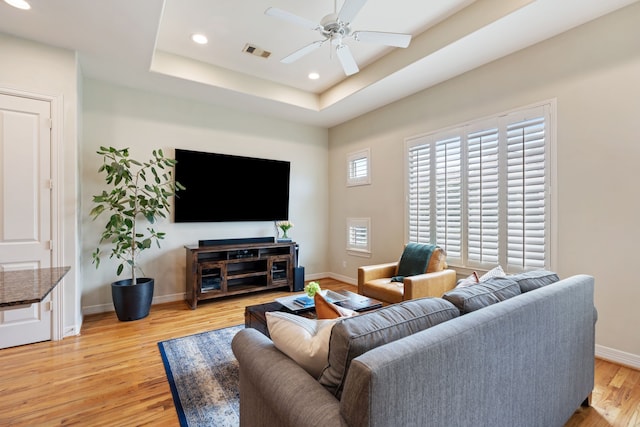 3908 Center St, Houston, TX 77007 - living area featuring light wood-style flooring, ceiling fan, recessed lighting, and a raised ceiling