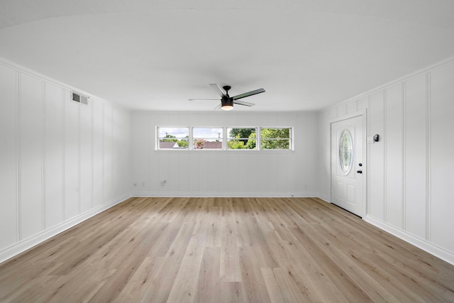 7711 Greenstone St, Houston, TX 77087 - entrance foyer with a decorative wall, light wood-style flooring, and a ceiling fan
