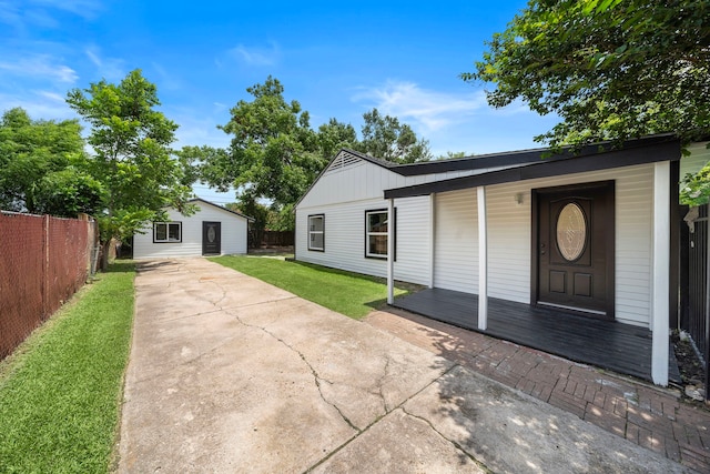 7711 Greenstone St, Houston, TX 77087 - view of front facade with an outbuilding and covered porch