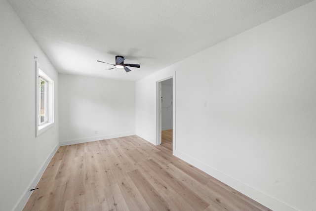 7711 Greenstone St, Houston, TX 77087 - empty room featuring light wood finished floors, a ceiling fan, and a textured ceiling