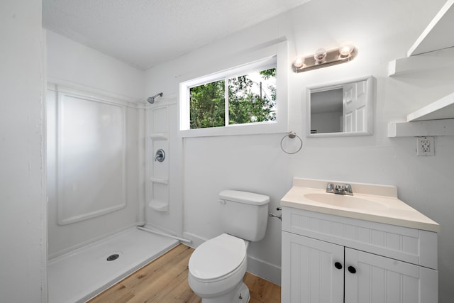 7711 Greenstone St, Houston, TX 77087 - full bath featuring a shower, vanity, wood finished floors, and a textured ceiling