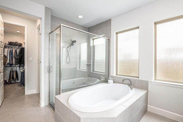 3119 Honeysuckle Way, Katy, TX 77493 - full bath featuring a bath, a shower stall, a walk in closet, and recessed lighting